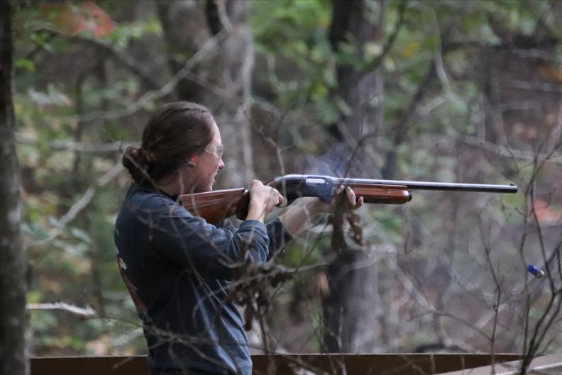 Woman shooting a gun